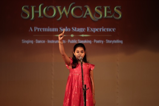Child performing solo vocals on stage — Singing Star category