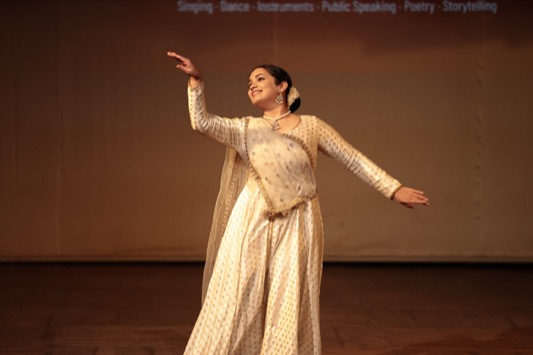 Child taking a bow after a solo dance performance